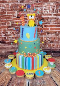 three tier bright kids lion theme first birthday cake - Tamworth