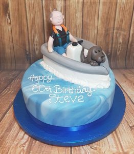 Man and dog in boat birthday cake - tamworth