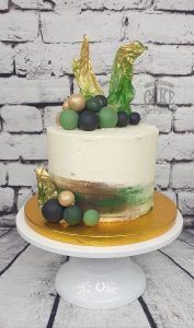 modern brushed buttercream sails and balls green and gold cake - Tamworth