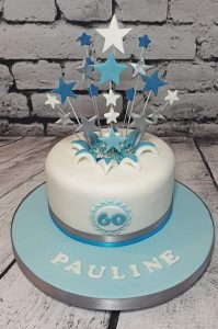 blue starburst 60th birthday cake - tamworth