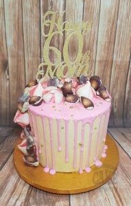 pink drip cake with sea shells and meringues - Tamworth