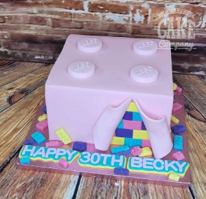 pink lego block reveal birthday cake - tamworth