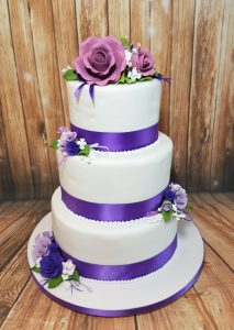 three tier purple floral wedding cake - tamworth