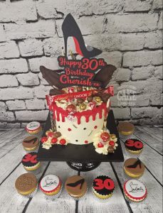 red shoe theme drip cake and cupcakes - Tamworth