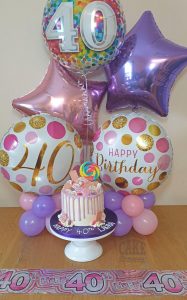 purple drip cake with matching balloons - tamworth