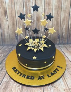 black and gold starburst retirement cake - tamworth