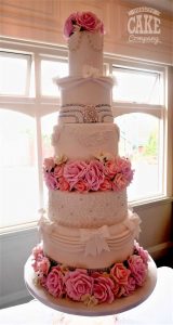 suspended elaborate wedding cake with lots of textures and elements bling pink flowers bows Tamworth West Midlands Staffordshire