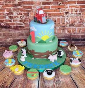 two tier farm cake tractor and matching cupcakes - Tamworth