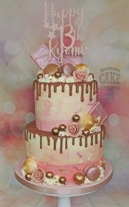 two tier rose gold drip cake - tamworth