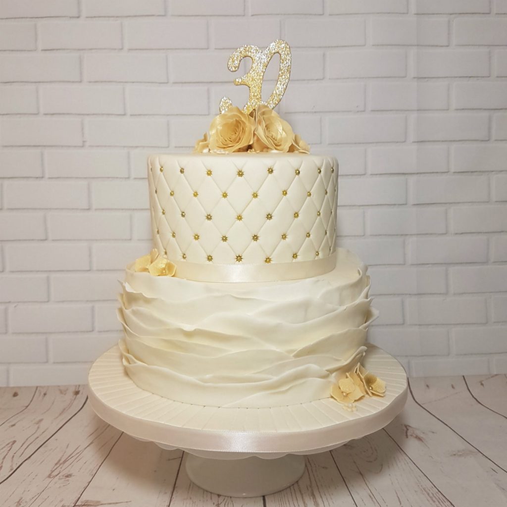 two tier ivory and gold pearl anniversary cake - Tamworth