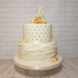 two tier ivory and gold pearl anniversary cake - Tamworth