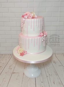 two tier pink and white drip cake with flowers - Tamworth