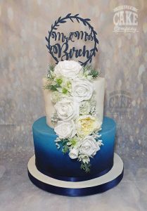 Blue ombre two tier wedding cake with topper and white rose cascade Tamworth West Midlands Staffordshire