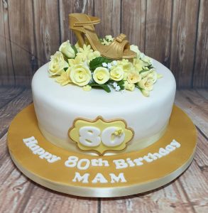 yellow floral cake with gold stiletto - tamworth