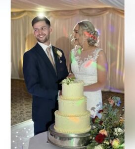 Elegant wedding cake with happy couple