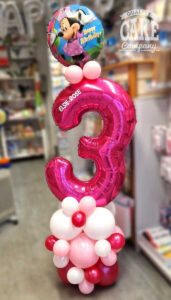 minnie mouse themed balloon display for a 3rd birthday