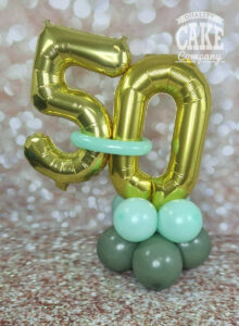 sage green and gold 50th birthday table balloon display - Tamworth