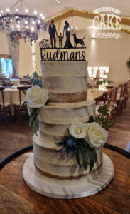 semi naked wedding cake with roses coton house - tamworth