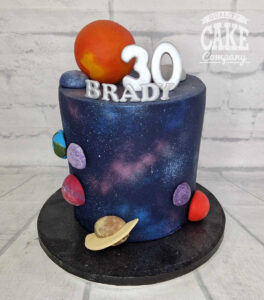 tall space theme cake with planets 30th birthday - tamworth