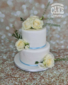 Two tier wedding cake blue ribbon piped dots - tamworth