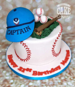 baseball theme cake with cap, bat and balls
