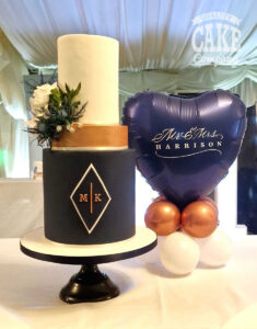 navy and rose gold wedding cake with matching balloon - Tamworth