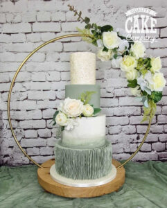 four tier sage green modern wedding cake in a hoop stand - Tamworth