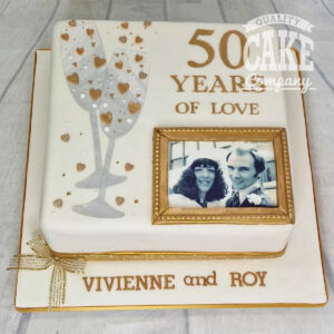 50th wedding anniversary glasses and photo cake