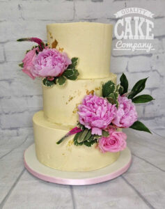 three tier buttercream cake with fresh peonies - tamworth