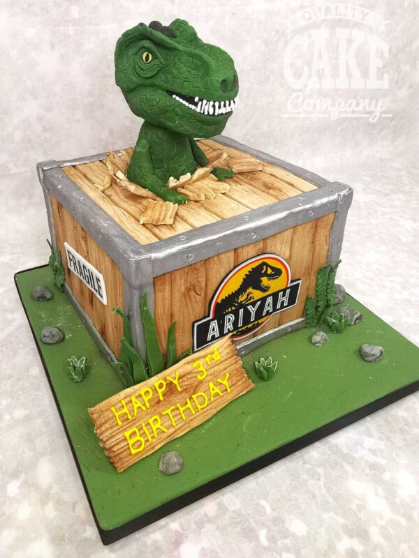 t-rex in a crate kids jurassic park themed birthday cake