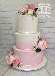 three tier ombre pink wedding cake with silk flowers - Tamworth