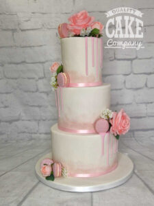 three tier tall wedding cake with drips and macarons - tamworth