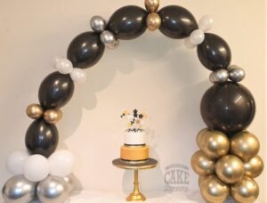 table arch balloon black and gold